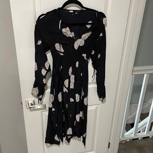 All saints silk dress with lots of slits. White flower design